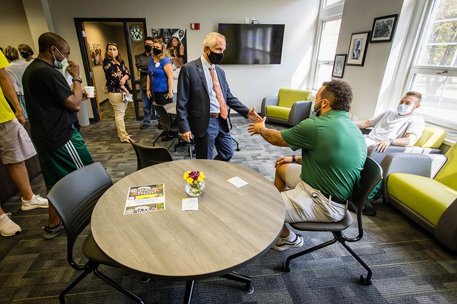 Northwest President Dr. John Jasinski greets students and staff Thursday as he tours the remodeled Office of Diversity and Inclusion.